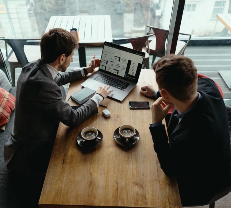 employee-disinfecting-electronic-device